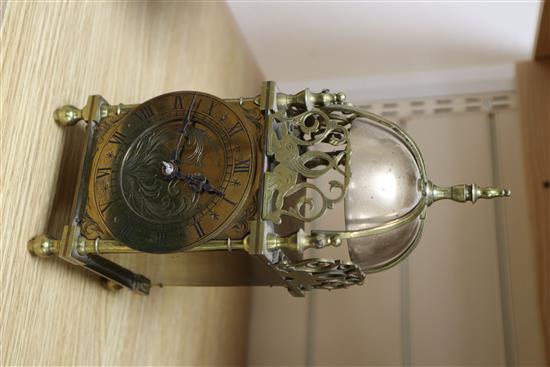 A mantel timepiece in the form of a brass lantern clock, height 26cm